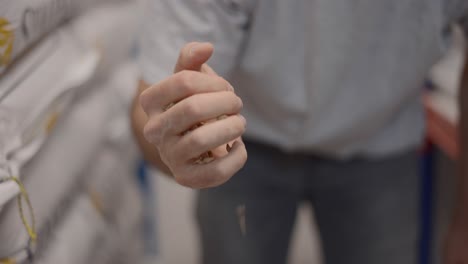 hand handling grain