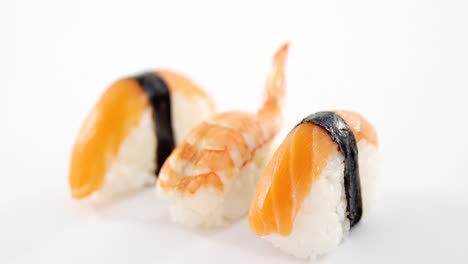 sushi roll and shrimp on white background