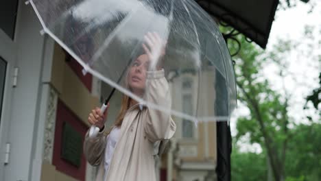 blonde woman going upstrairs to hide from the rain