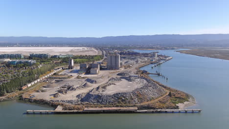 Aerial-Orbit-Around-Cement-Plant-on-the-Water