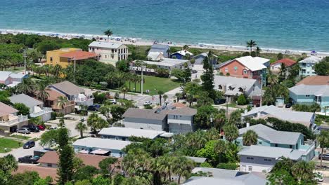 Aerial-establishing-shot-of-Cape-Canaveral-City-with-Beach-and-cruising-boat-on-sea