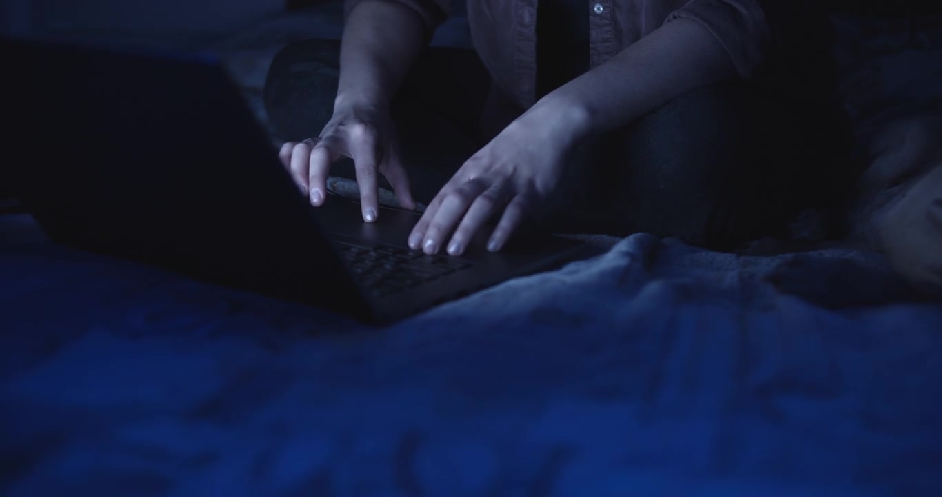 Hands of woman using a laptop