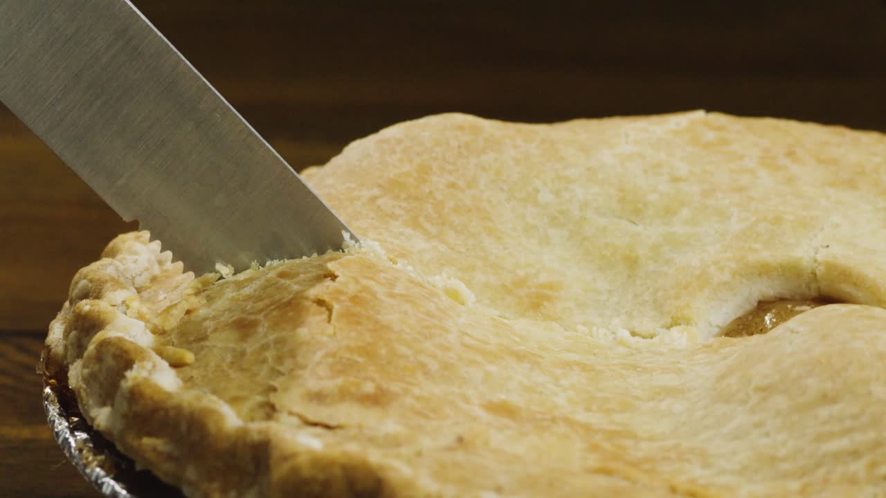 Knife cutting a slice of Pie