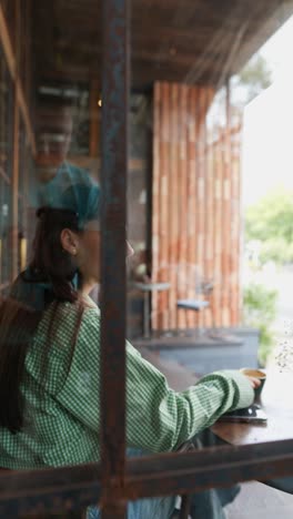 woman drinking coffee in a cafe