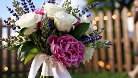 wedding bouquet with roses, peonies, and lavender