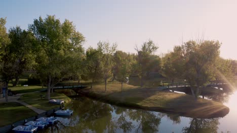 Apollo-Park-Lake-with-kayaks-and-boats-at-golden-hour-in-Lancaster,-California