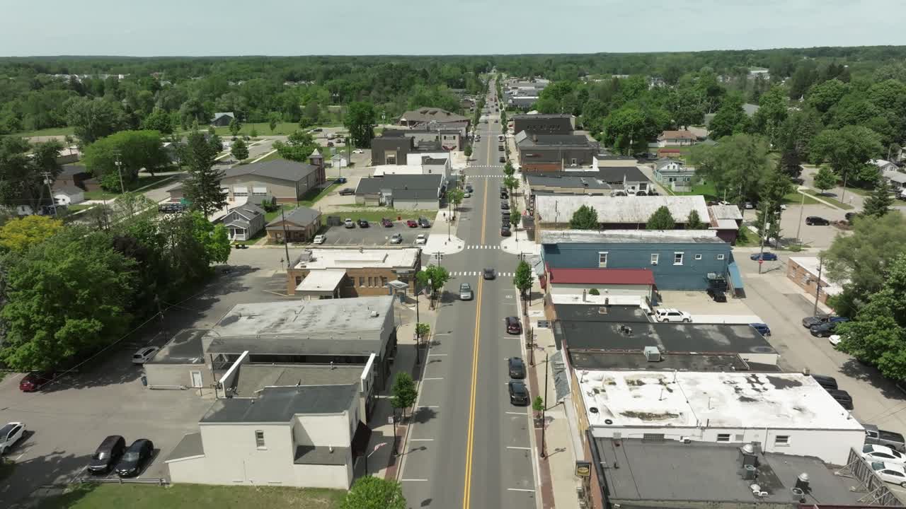 Cedar Springs, Michigan downtown with drone video moving down.