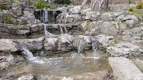 sloe motion footage of water cascading down the rocks of a water fall.