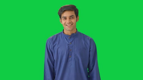 cute indian boy winking and smiling green screen