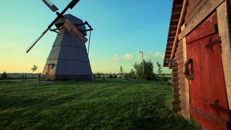 rural house on village landscape. panoramic view of country house and windmill