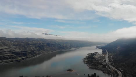 A-drone-spins-around-while-flying-over-a-river-in-Oregon