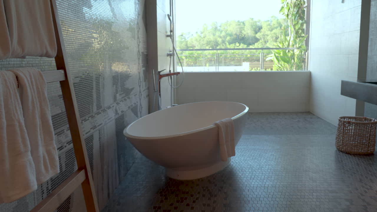 Oval White Ceramic Tub. Hotel Resort Bathroom Interior. Sideways Shot