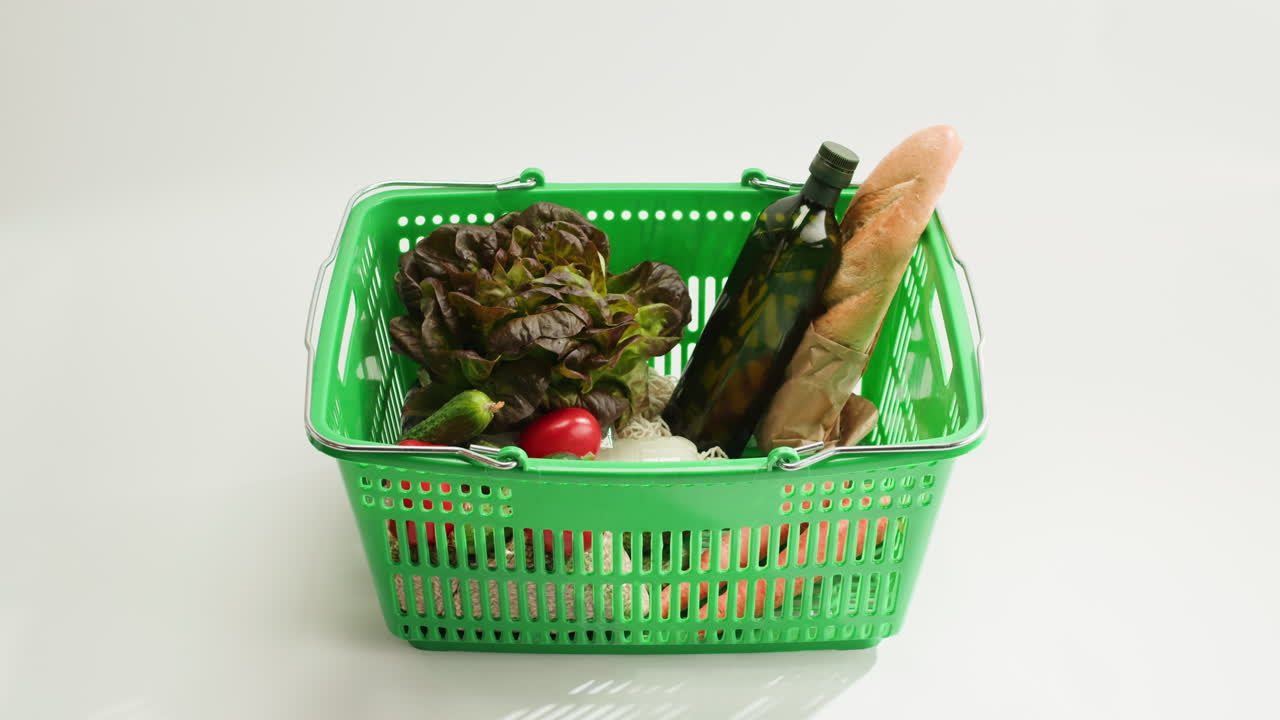 Woman Shopping with a Green Plastic Basket