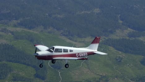 piper cherokee small plane flying, parallax formation footage