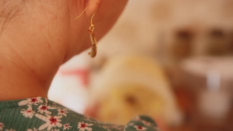 close-up from behind of a woman in focus beating a flour dough to prepare a dessert