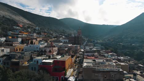 fantastic aerial view over a traditional mexican mountain village during sunrise, aerial drone footage