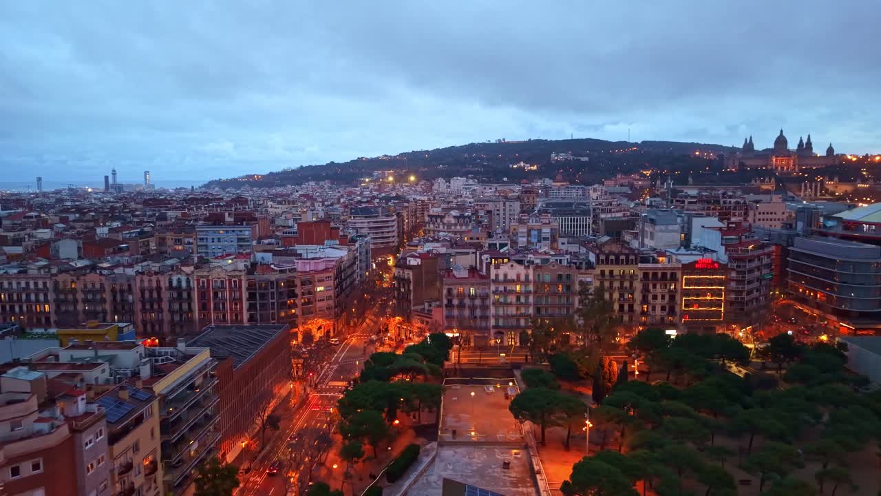 La Nova Esquerra de l'Eixample neighborhood in Barcelona at dusk, Spain. Aerial forward, copy space
