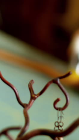 mid-section of craftswoman hammering leather
