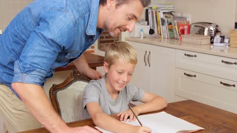 Lovely-father-helping-his-son-with-homework