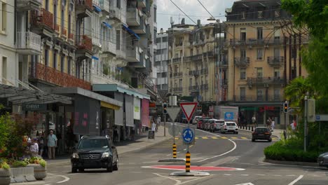 sunny day time montreux city center famous traffic street circle slow motion panorama 4k switzerland