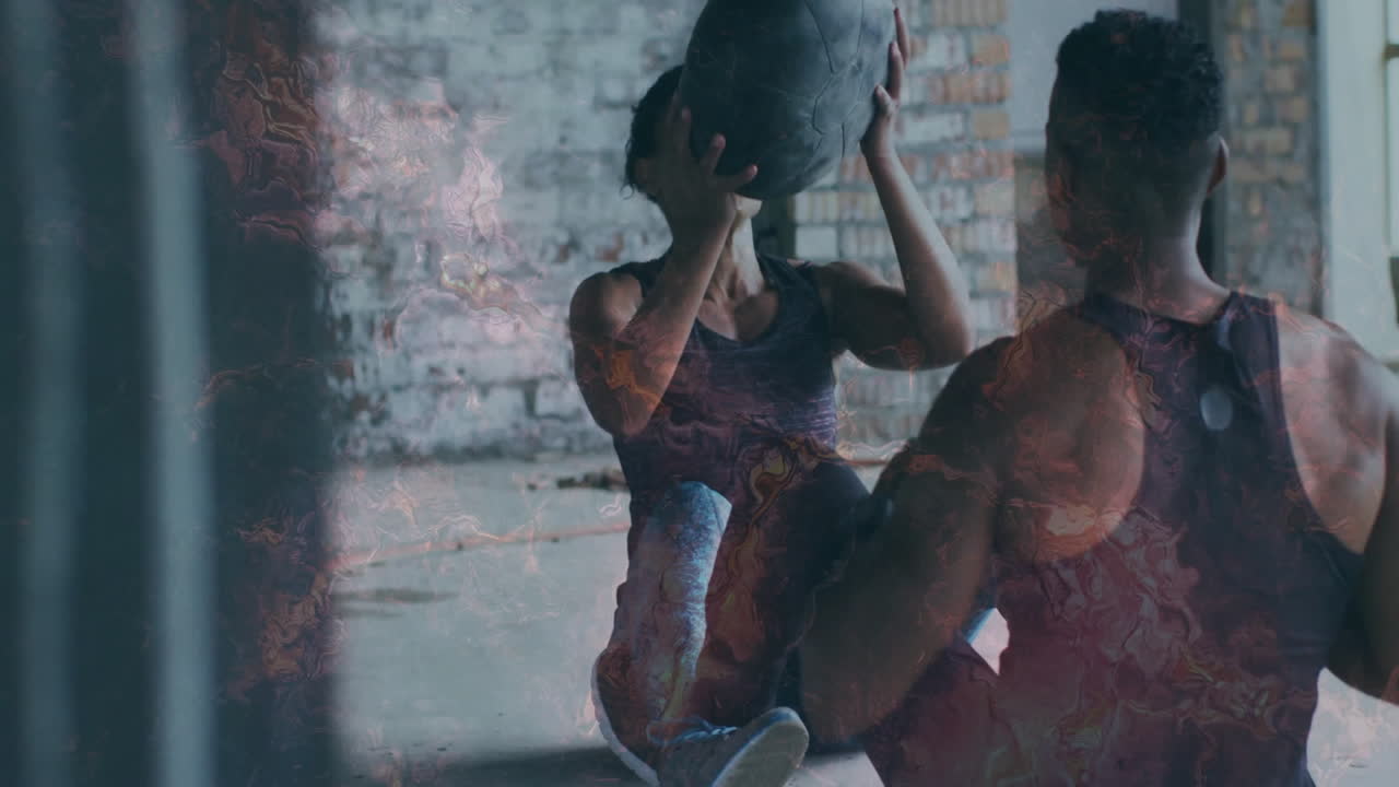 In gym, two people exercising with medicine ball, focusing on fitness animation