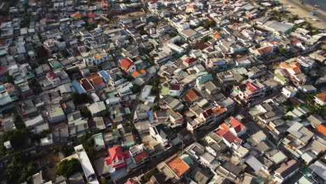 Dense-packed-village-houses-on-island-ocean-beach-coast