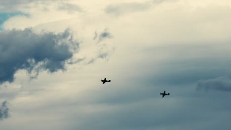 multiple planes flying in dynamic patterns across clouds