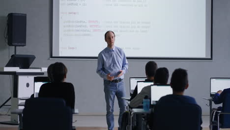 teacher leading a computer science class