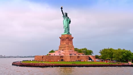 statue of liberty from low angle perspective. some building materials at the foot of the monument. new york, usa