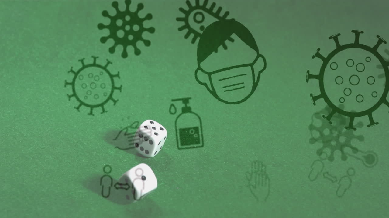 animación de células e iconos de covid-19 sobre dos dados en un fondo verde