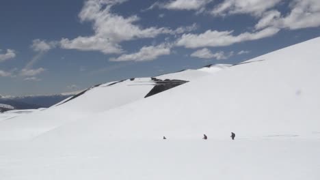 People-walking-in-a-mountain-with-snow-in-Chile