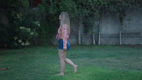 woman walking barefoot in a park