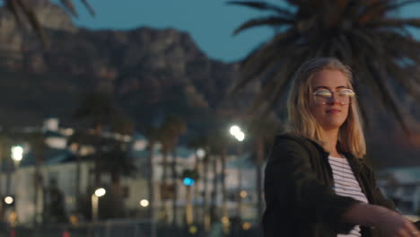 teenage-girl-dancing-with-sparklers-on-beach-at-sunset-celebrating-new-years-eve-having-fun-independence-day-celebration-with-fireworks-enjoying-freedom