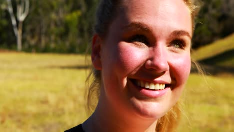 portrait of happy woman in boot camp