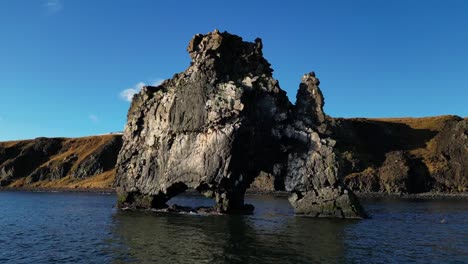 Drone-shot-of-Hvitserkur-rock-formation-on-water-in-Iceland-during-winter2