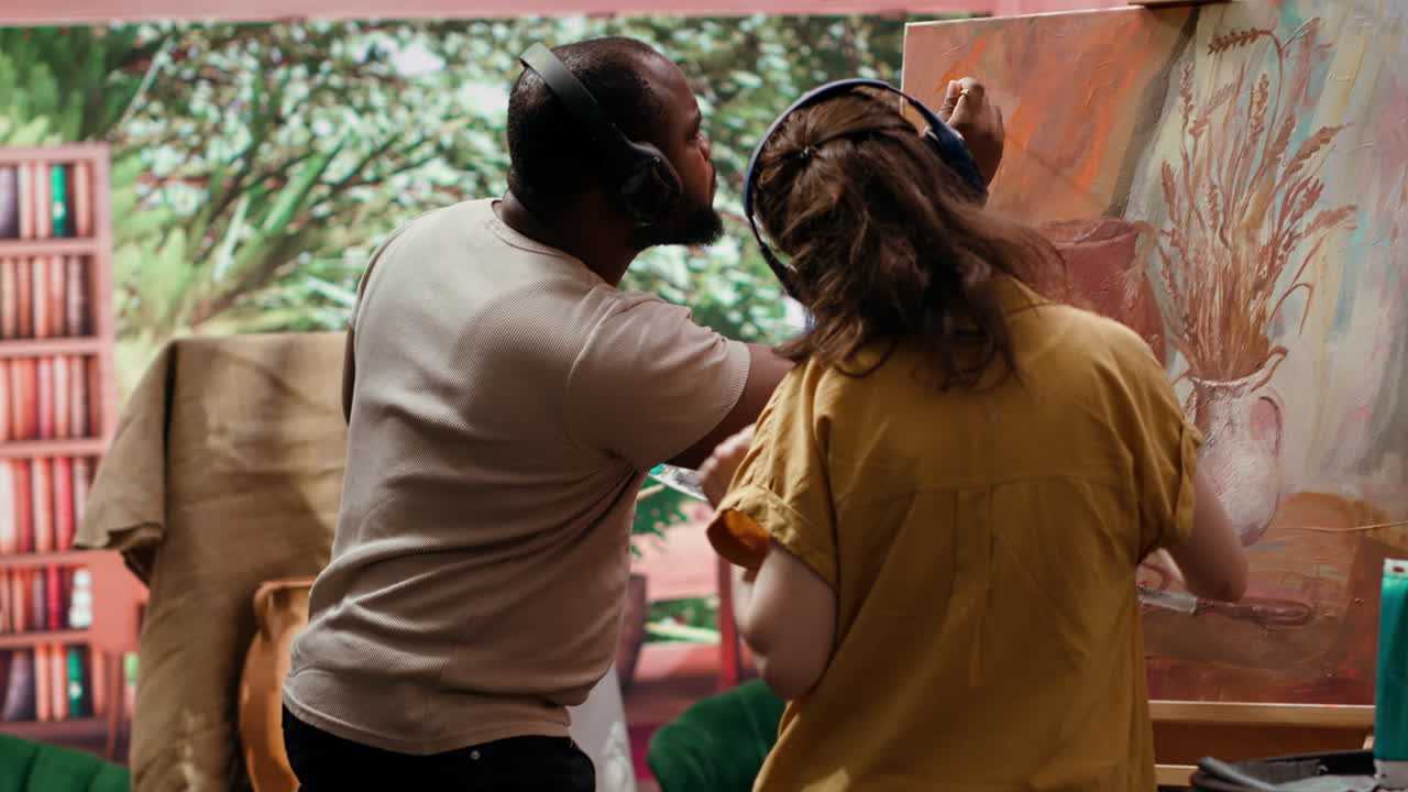 People painting a still life together