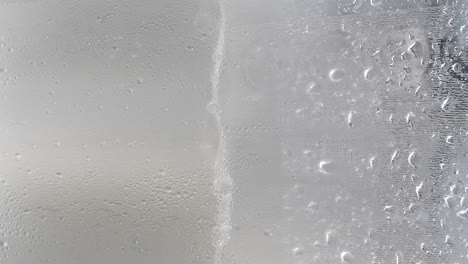 water droplets on cold glass surface