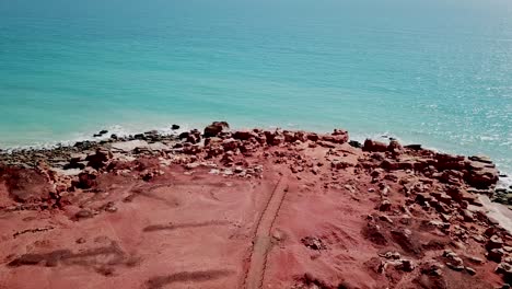 Aerial-view-of-Gantheaume-Point-and-the-lighthouse-protecting-its-shore-in-Western-Australia