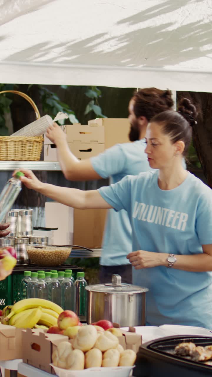Vertical video Volunteers Helping the Hungry with Care