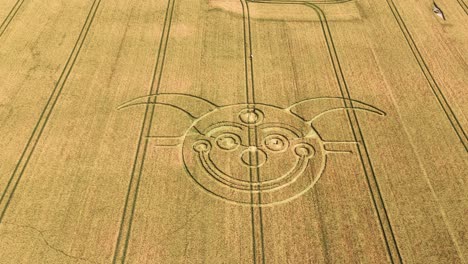 establishing aerial view of stonehenge jester crop circle tilt to reveal vast farmland countryside