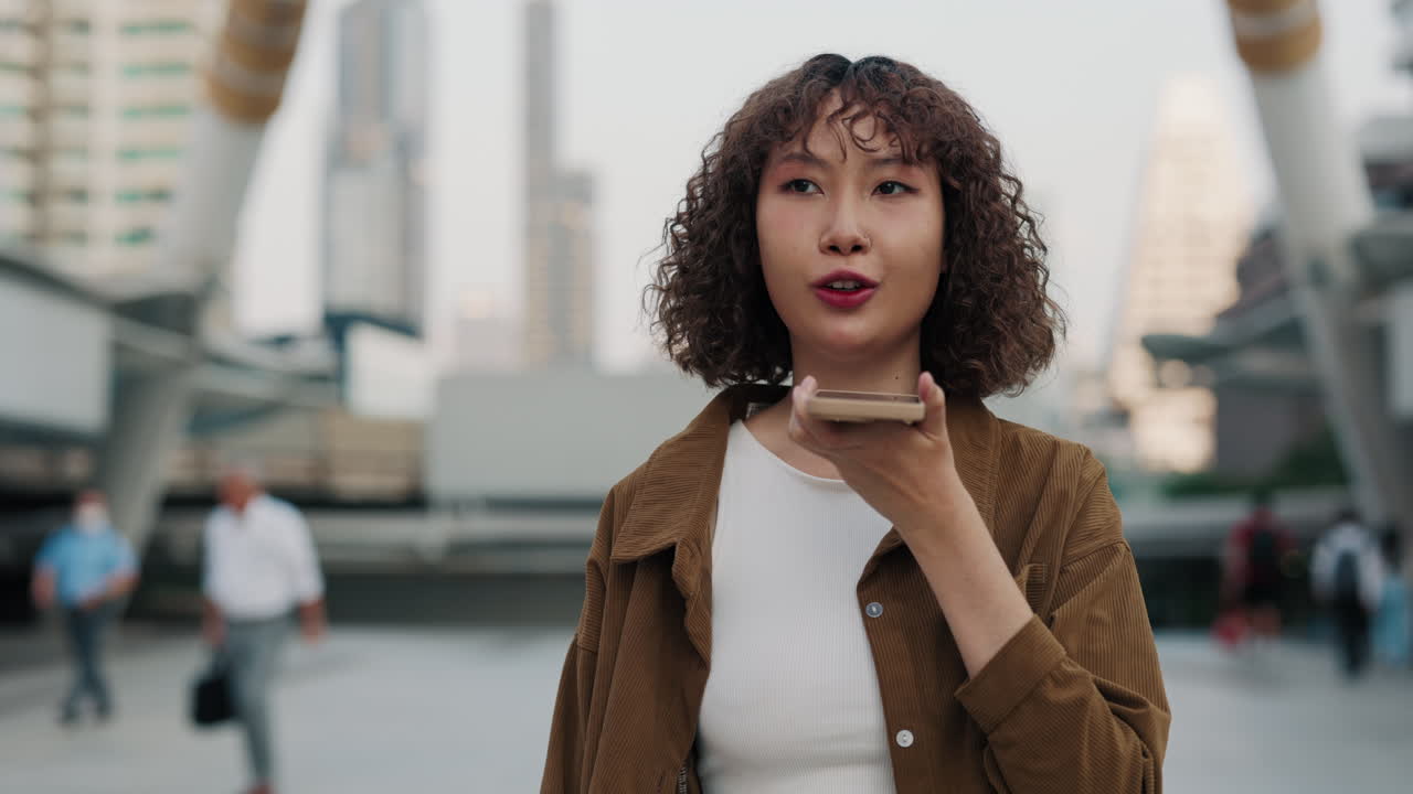 Woman using smartphone in city