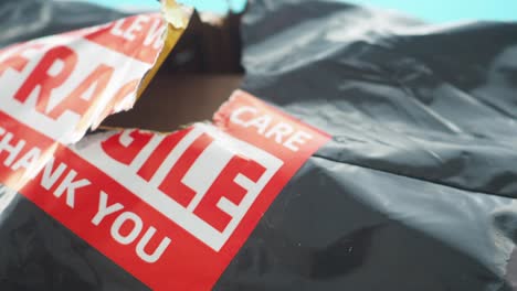 damaged package with fragile label