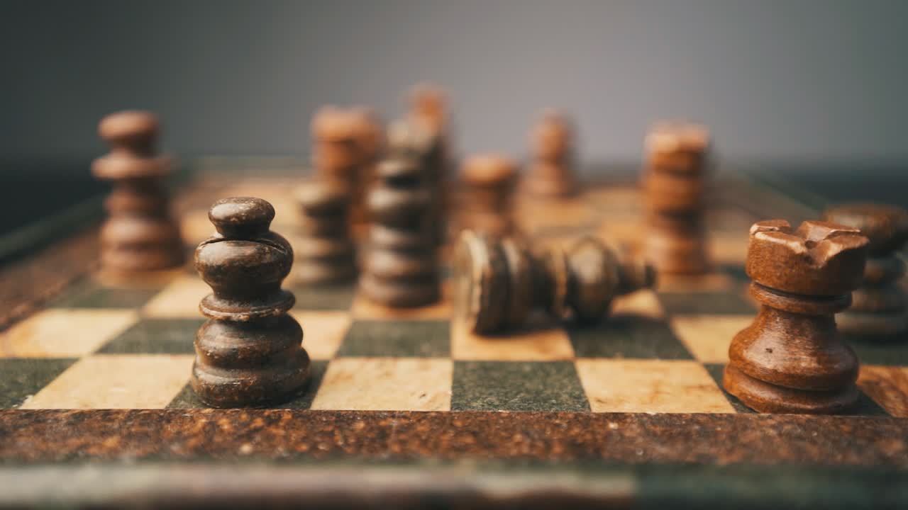 Chess king falling down in slow motion