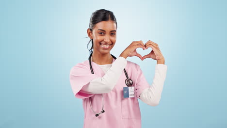 Heart,-hands-and-face-of-woman-doctor-in-studio