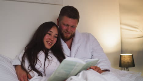 couple reading in bed