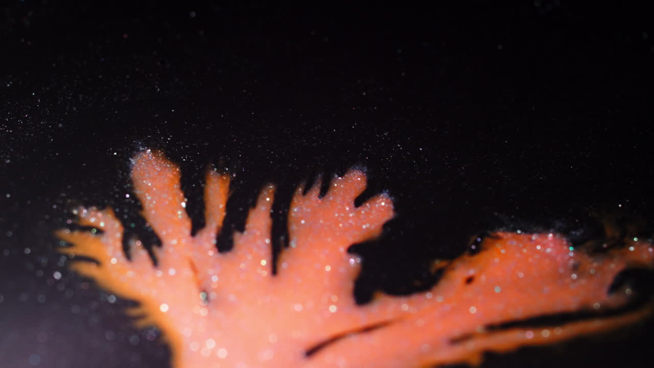 Macro view of colorful substances mixing in artistic pattern