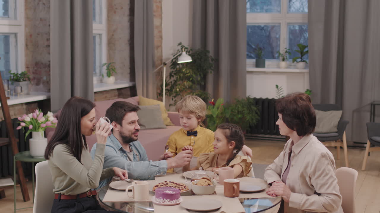 Family gathering around the table