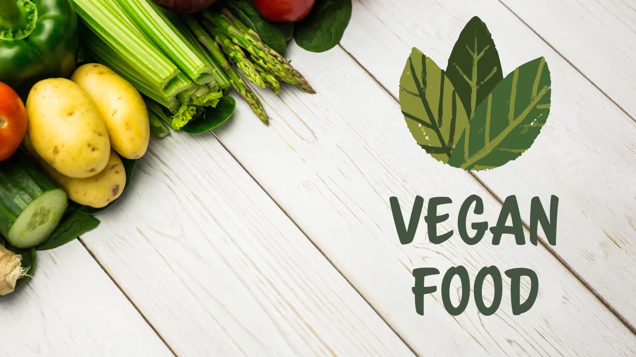 animación de texto de alimentos veganos en verde, con hojas sobre verduras frescas en tableros blancos