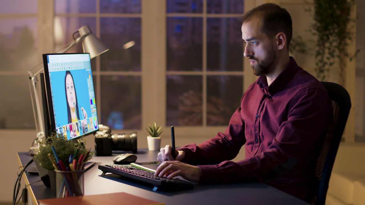 Man working on graphic design project at his desk