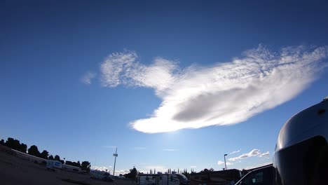 Time-lapse-of-a-cloud-in-a-winter-sky-over-a-RV-Park-and-Campground-the-Sonoran-desert-in-Arizona,-USA